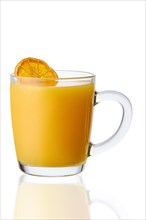 Glass of warm orange tea isolated on white background