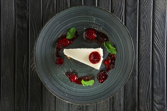 Top view of cheese cake decorated with cherry