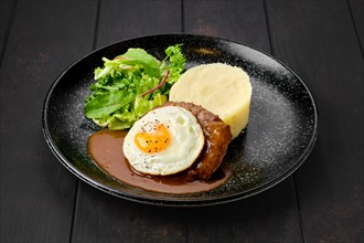 Beef cutlet with fried egg