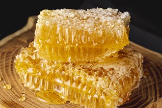 Close up honeycombs wooden platter
