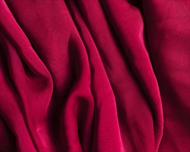 Texture burgundy red crumpled fabric. Resolution and high quality beautiful photo