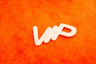 VIP written with letters on a colorful background