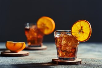 Cocktail old fashioned with hard light and harsh shadows