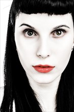 Portrait young woman with long black hair and red lips