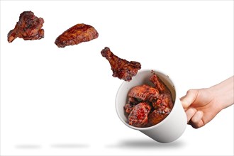 Catching flying fried chicken wings in cardboard container