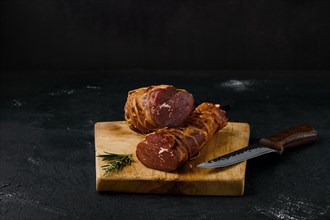 Smoked beef fillet meat on cutting board
