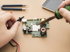 Man using soldering iron circuit 1