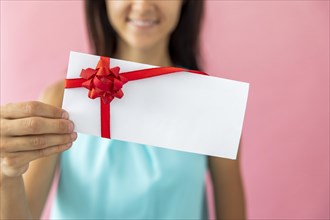 Smiley woman showing envelope. Resolution and high quality beautiful photo