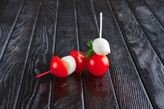 Appetizer for reception. Cherry tomato with small ball of mozzarella