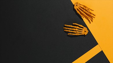 Two skeleton hands orange paper. Resolution and high quality beautiful photo