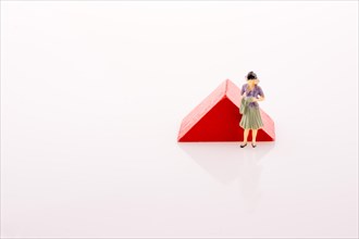 Woman figure near a color block on a white background