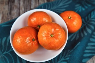 Bowl with fresh mandarin orange fruits
