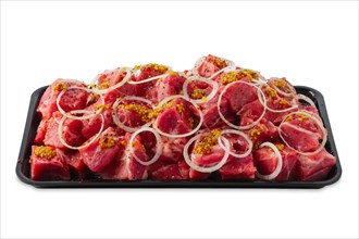Tray with marinated meat cutted on pieces and ready for shashlik or kebab isolated on white