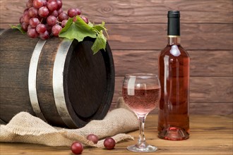 Wooden barrel with bottle glass wine. Resolution and high quality beautiful photo