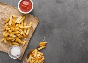 Top view french fries paper with salt copy space. Resolution and high quality beautiful photo