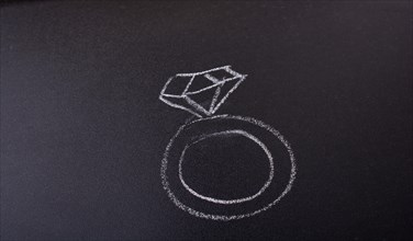 Diamond ring drawn on a blackboard in view