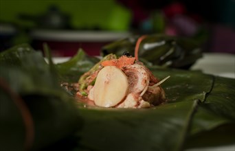 Nacatamal ingredients on banana leaves