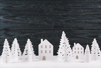 Paper winter city wooden background