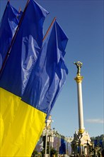 Independence square of capital city Kiev and Ukrainan flag