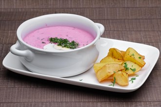 Traditional russian cold beetroot soup with fried potato