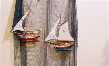 Set of small colorful model sailboats