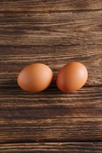 Two eggs on wooden table