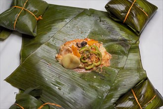 Top View of raw ingredients of the Nicaraguan nacatamal on banana leaves. Raw ingredients for the preparation of the traditional Nacatamal