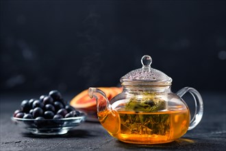Low key photo of blueberry and blood orange tea