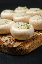 Closeup view of champignons stuffed with parsley