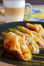 Thin pancakes with chicken and pineapple