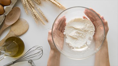 Top view hands holding bowl with flour. Resolution and high quality beautiful photo