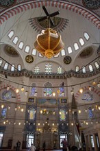 Bright Lamps on circular chandelier in a big mosque