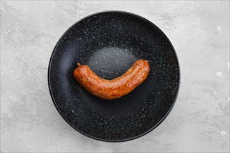 Fried bavarian sausage on a plate