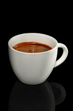 Ceramic cup of coffee isolated on black