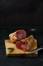 Smoked beef fillet meat on cutting board