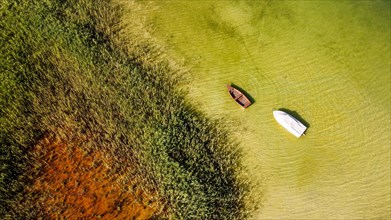 Beautiful drone shot of the lake and boats