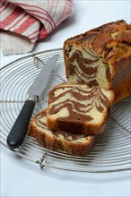 Marble cake and knife on cake rack
