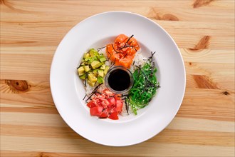 Salmon sashimi rice bowl with avocado