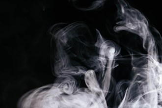 Grey smoke waves black background