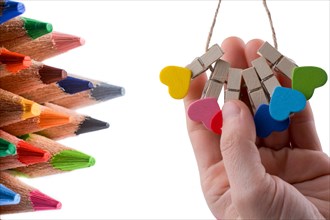 Color pencils of various color and colorful domino pieces