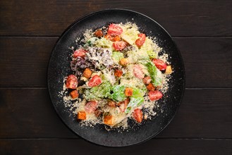 Caesar salad with fresh vegetables