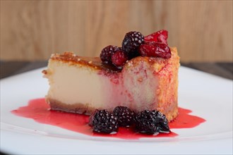 Piece of cheesecake with cherry