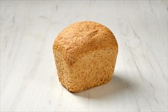 Artisan bread made from oats seeds on kitchen table