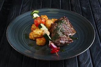 Juicy grilled beef fillet with potato