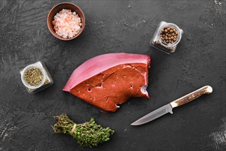 Raw fresh beef liver with spice and herbs