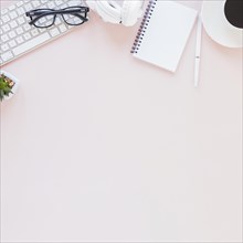 Workplace with various gadgets notebook coffee cup pink background. Resolution and high quality beautiful photo