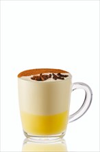 Hot milk and honey winter drink with anise and cinnamon isolated on white