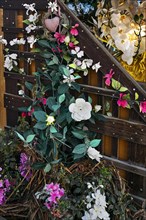 Trellis with artificial flowers