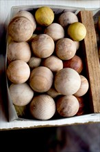 Plenty of wooden balls of light brown color