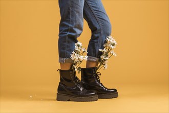 Woman legs wearing boots with flowers inside. Resolution and high quality beautiful photo